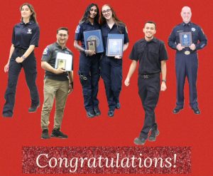 Six people in uniform pose and smile while holding plaques and awards against a red background with the text "Congratulations!" at the bottom.